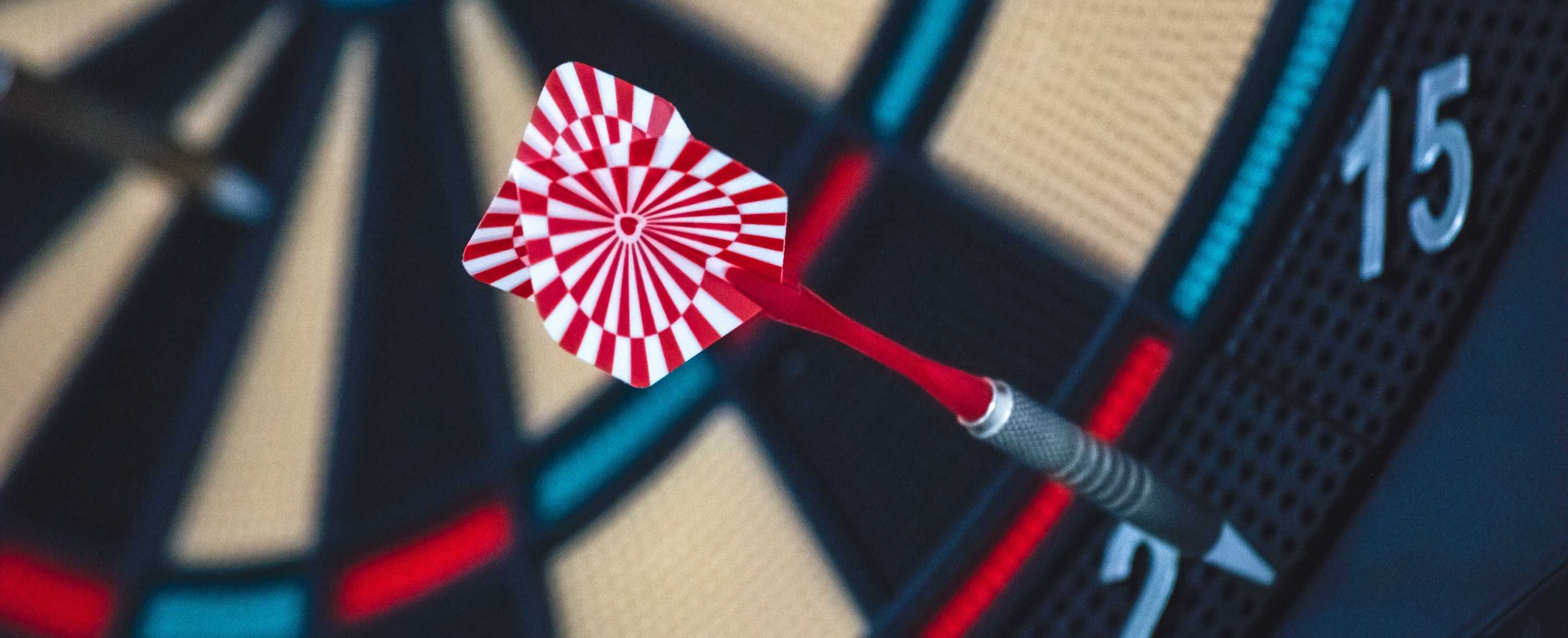 a dart hitting a dart board outer ring near the two