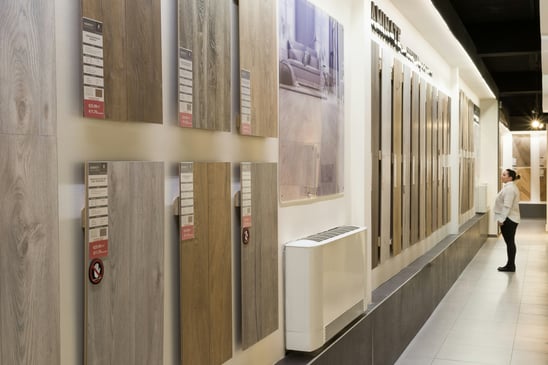 Woman Shopping for Flooring in Showroom