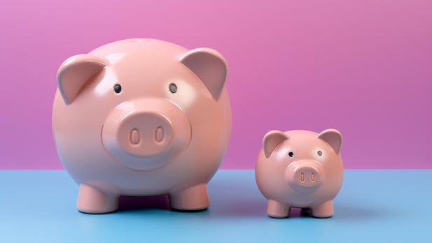 vecteezy_two-piggy-banks-symbolizing-savings-and-investment-growth-on_65303817-1